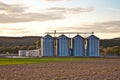 Silos in sunset with beautiful view over acres Royalty Free Stock Photo