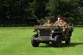 World War 2 Jeep with men dressed as World War 2 British soldiers in red berets.