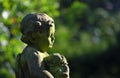 Detail of statue of small boy with puppy,