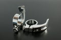 Silver alloy quick release seatpost clamp, bicycle spare parts, on a black background. Royalty Free Stock Photo