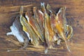 Silver Amber Fish with pepper on wooden background. Snack to beer. Close up