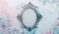 Silver antique frame in the middle, delicate floral watercolor background, space for text Royalty Free Stock Photo