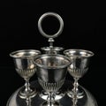 Silver antique set of glasses on a stand with engraving.