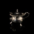 Metal retro sugar bowl on black background Royalty Free Stock Photo