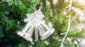 Silver bells hanging on a Christmas tree Royalty Free Stock Photo