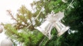 Silver bells hanging on a Christmas tree Royalty Free Stock Photo