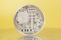 Silver bitcoin coin on yellow Royalty Free Stock Photo