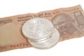 Silver bitcoin coins on Indian Ten Rupee