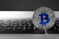 Silver bitcoin on computer keyboard. Digital currency Royalty Free Stock Photo