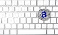 Silver bitcoin on computer keyboard. Space for text Royalty Free Stock Photo