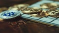 Silver bitcoin cymbol on keyboard. Selective focus.