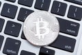 Silver bitcoin isolated on computer key board background. Royalty Free Stock Photo