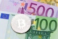 Silver Bitcoins close-up on euro currency background. Royalty Free Stock Photo