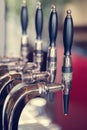 Silver and black beer taps close up Royalty Free Stock Photo