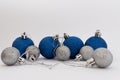 Silver and blue Christmas balls on white background Royalty Free Stock Photo