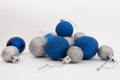 Silver and blue Christmas balls on white background Royalty Free Stock Photo