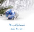 Silver and Blue Christmas ornaments balls on glitter bokeh background with space for text. Xmas and Happy New Year Royalty Free Stock Photo