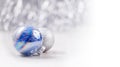 Silver and Blue Christmas ornaments balls on glitter bokeh background with space for text. Xmas and Happy New Year Royalty Free Stock Photo