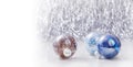 Silver and Blue Christmas ornaments balls on glitter bokeh background with space for text. Xmas and Happy New Year Royalty Free Stock Photo