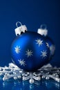 Silver and blue christmas ornaments on dark blue background with space for text Royalty Free Stock Photo