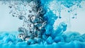 Silver and blue ink swirling and dissolving in clear liquid in slow motion Royalty Free Stock Photo