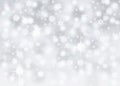 Silver bokeh abstract background with falling snowflakes and sparkles