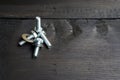 Silver bolt nut on black wooden table