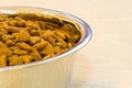 Silver bowl of cat food Royalty Free Stock Photo