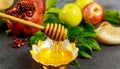 Silver bowl with honey and fruits for Yom Kippur