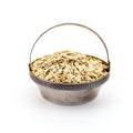 A silver bowl of uncooked rolled oats isolated on white background Royalty Free Stock Photo