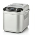 Silver bread maker machine with a sleek, rectangular design and rounded edges. The Royalty Free Stock Photo