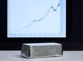 Silver bullion on the background of the growth chart Royalty Free Stock Photo