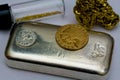 Silver Bullion Bar, Gold Coin and Gold Nuggets