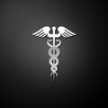 Silver Caduceus medical symbol icon isolated on black background. Medicine and health care concept. Emblem for drugstore Royalty Free Stock Photo