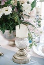 Silver candlestick as element of festive table wedding decorations. Royalty Free Stock Photo