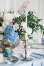 Silver candlestick as element of festive table wedding decorations. Royalty Free Stock Photo