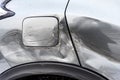 Silver car after the accident, broken door, fender and fuel tank close-up. Car accident close-up Royalty Free Stock Photo