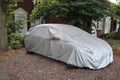 Silver car cover used to protect the car against the elements