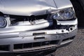 Silver car damaged by traffic accident