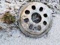 Silver Car Hubcap Lying In Snow Royalty Free Stock Photo