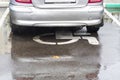 a silver car is parked on a sign. place for the disabled. close-up. it's raining. autumn. shamefully Royalty Free Stock Photo