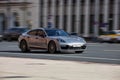 Silver car Porsche 971 Panamera at the city street. Panamera GTS fast moving car on the motorway. Vehicle driving along the street Royalty Free Stock Photo