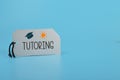 Silver card written with TUTORING. Tutoring provides a personalized and tailored approach to learning, helping students to