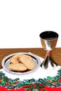 Silver chalice with bread on Christmas background