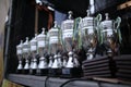 Silver champion trophies lined up in rows Royalty Free Stock Photo