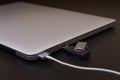 Silver charging laptop with flash usb disk on key