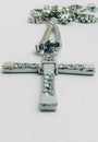 Silver christian cross necklace isolated on white. Cross of silver on a chain Royalty Free Stock Photo