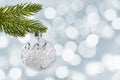 2019 on a silver christmas ball hanging from a branch bokeh lights background Royalty Free Stock Photo