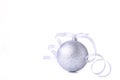 Silver Christmas ball with ribbon on white background Royalty Free Stock Photo