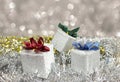 Silver Christmas gift box decoration with silver glister blurred background